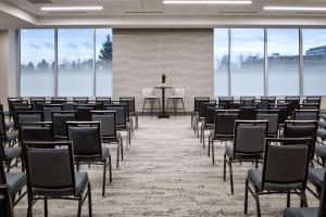a room with rows of chairs and a table at Hyatt House Denver Aurora in Aurora