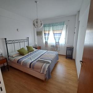 Ένα ή περισσότερα κρεβάτια σε δωμάτιο στο Oasis en Belgrano