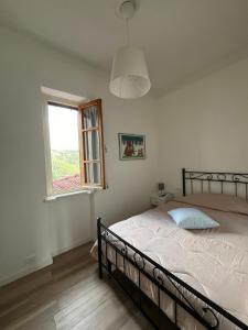 Postel nebo postele na pokoji v ubytování La Colombaia