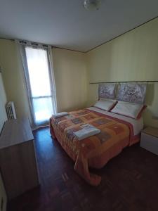 Postel nebo postele na pokoji v ubytování Appartamento Bersani
