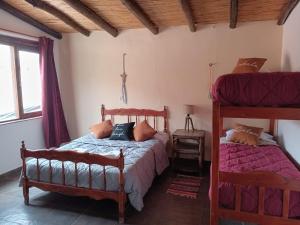 A bed or beds in a room at Hotel Cactus Plaza