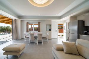 a living room with a couch and a table at Villa Rudi in Atsoupádhes