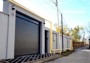 a row of garage doors on a building at Villa Wolverine in Gabala