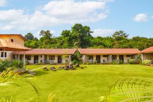 a house with a lawn in front of it at CASA AMORA in Lonavala