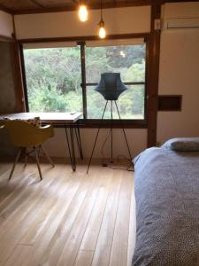 Postel nebo postele na pokoji v ubytování 朝食付き唐津里山の宿&ヨガ兎と亀