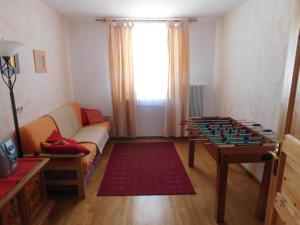 a living room with a table and a chess board at Holmbauer Ferienwohnung Panoramablick in Ober-Etrach