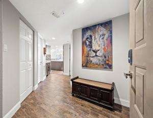 a hallway with a painting on the wall at Arie Dam 404 in St. Pete Beach +50 photos