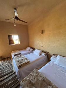 Postel nebo postele na pokoji v ubytování Agpeninshal Ecolodge