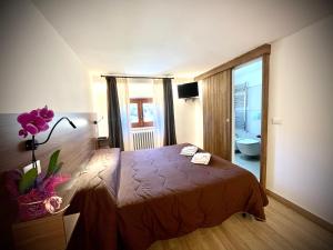 Posteľ alebo postele v izbe v ubytovaní Hotel Pinguino