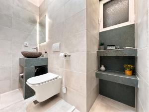 Koupelna v ubytování Seaside Deluxe Apartment