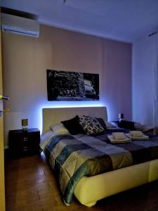 a bedroom with a bed with a blue light at casale in Brindisi