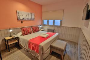 Postel nebo postele na pokoji v ubytování Hotel Bariloche By Tierra Gaucha