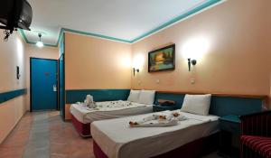 En eller flere senge i et værelse på KLEOPATRA SUNLIGHT HOTEL