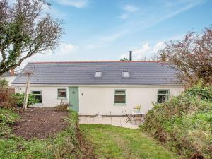 a white house with a grey roof at Meadow View - Uk44608 in Carnbrea