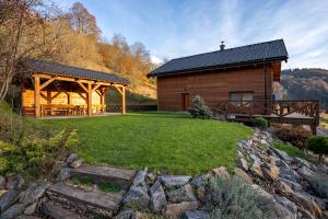 a log cabin with a gazebo next to a yard at Chalet Bystra - wellness 5 min-washer-game room-view-5 bedrooms in Mýto pod Ďumbierom