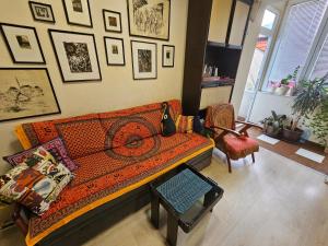 a living room with a couch and a table at The Traveling Theater in Belgrade