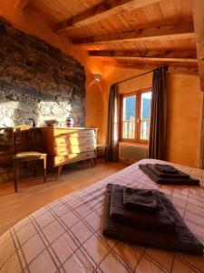 a bedroom with a bed and a dresser and a window at Apartment Belledonne 3 minutes from Alpe d Huez Grand Domaine via Oz en Oisans in Oz