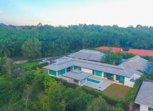 an aerial view of a house in the forest at CoaSea Pool Villa - 3 Bedrooms 3.5 Bathrooms in Chumphon