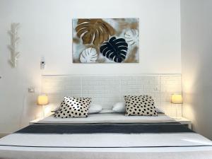 a bedroom with a bed with two pillows at Pit stop Ciampino Station in Ciampino +32 photos