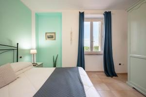 A bed or beds in a room at Ombra Verde Residence e B&B