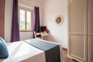 A bed or beds in a room at Ombra Verde Residence e B&B
