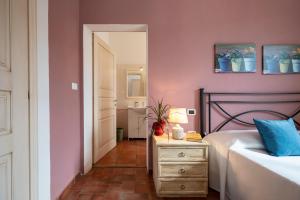 A bed or beds in a room at Ombra Verde Residence e B&B
