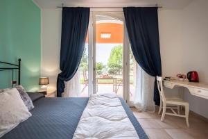 A bed or beds in a room at Ombra Verde Residence e B&B