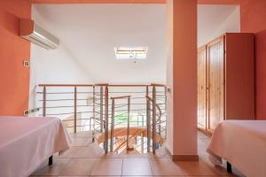 A bed or beds in a room at Ombra Verde Residence e B&B