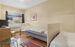 Postel nebo postele na pokoji v ubytování Cozy Apartment In Fan With Kitchen
