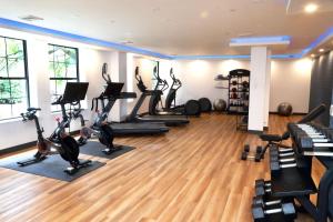 a gym with treadmills and elliptical machines at Four Points by Sheraton Wakefield Boston Hotel & Conference Center in Wakefield