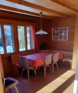 a dining room with a table and chairs at Casa Bereca in Flims