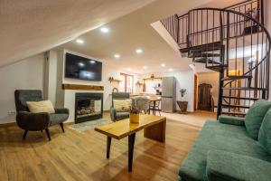 a living room with a couch and a fireplace at Casa Maya Transilvania in Sighişoara