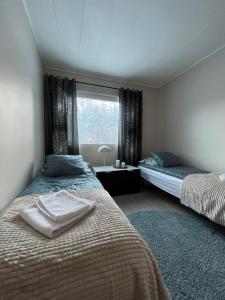 Postel nebo postele na pokoji v ubytování Kuurala apartment