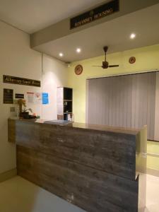 a kitchen with a large counter in a room at Alhanney Housing in Guwahati