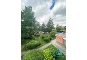 an aerial view of a garden and a building at Spacious Room in Gdańsk