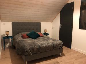 Postel nebo postele na pokoji v ubytování Maisonnette au cœur du vignoble