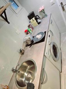 a small bathroom with a toilet and a sink at Appartement Neuf Orsay Le Guichet, proche des écoles Paris Saclay in Orsay +21 photos