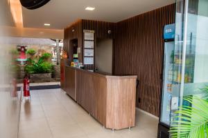 a lobby of a store with a counter in it at Apart Hotel Serantes in Natal