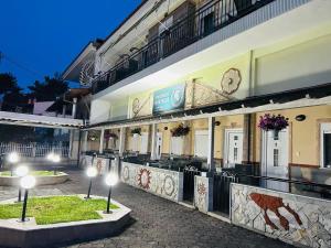 a building with street lights in front of it at Apartments Spartacus in Polychrono