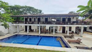 an image of a house with a swimming pool at Ahangama Eco Villa in Ahangama