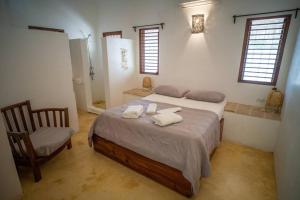 Postel nebo postele na pokoji v ubytování Adorable villa caribéenne à 300 mètres de la plage