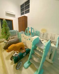 a childs room with a bed and a toy train at KL Panorama View City in Kuala Lumpur