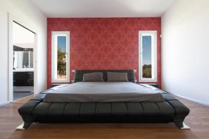 Säng eller sängar i ett rum på Villa Daiana by Perle di Puglia