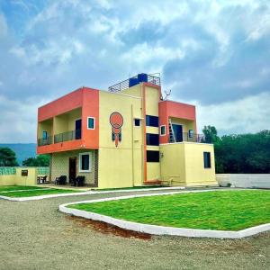 a building with a painting on the side of it at 5bhk- Nature Villa in Lonavala