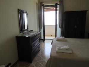 Letto o letti in una camera di Casa Vacanze Il Libeccio