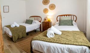 Postel nebo postele na pokoji v ubytování Casa Rural La Rosquilla + 33 fotografií
