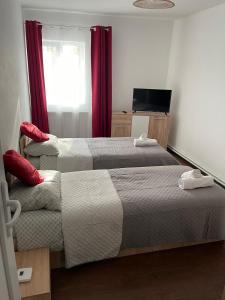 Cama ou camas em um quarto em White&Red Apartments