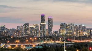 a city skyline at night with lit up buildings at Spacious 2BR Apartment, Large Kitchen, Parking Included in Mississauga