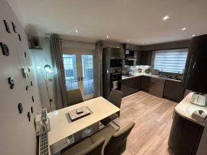 a kitchen with a table and chairs in a room at Spacious House To Accommodate 6 in Willaston