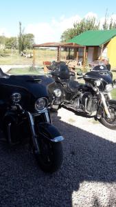 a couple of motorcycles parked next to each other at Cabañas Las Moras in Trenque Lauquen